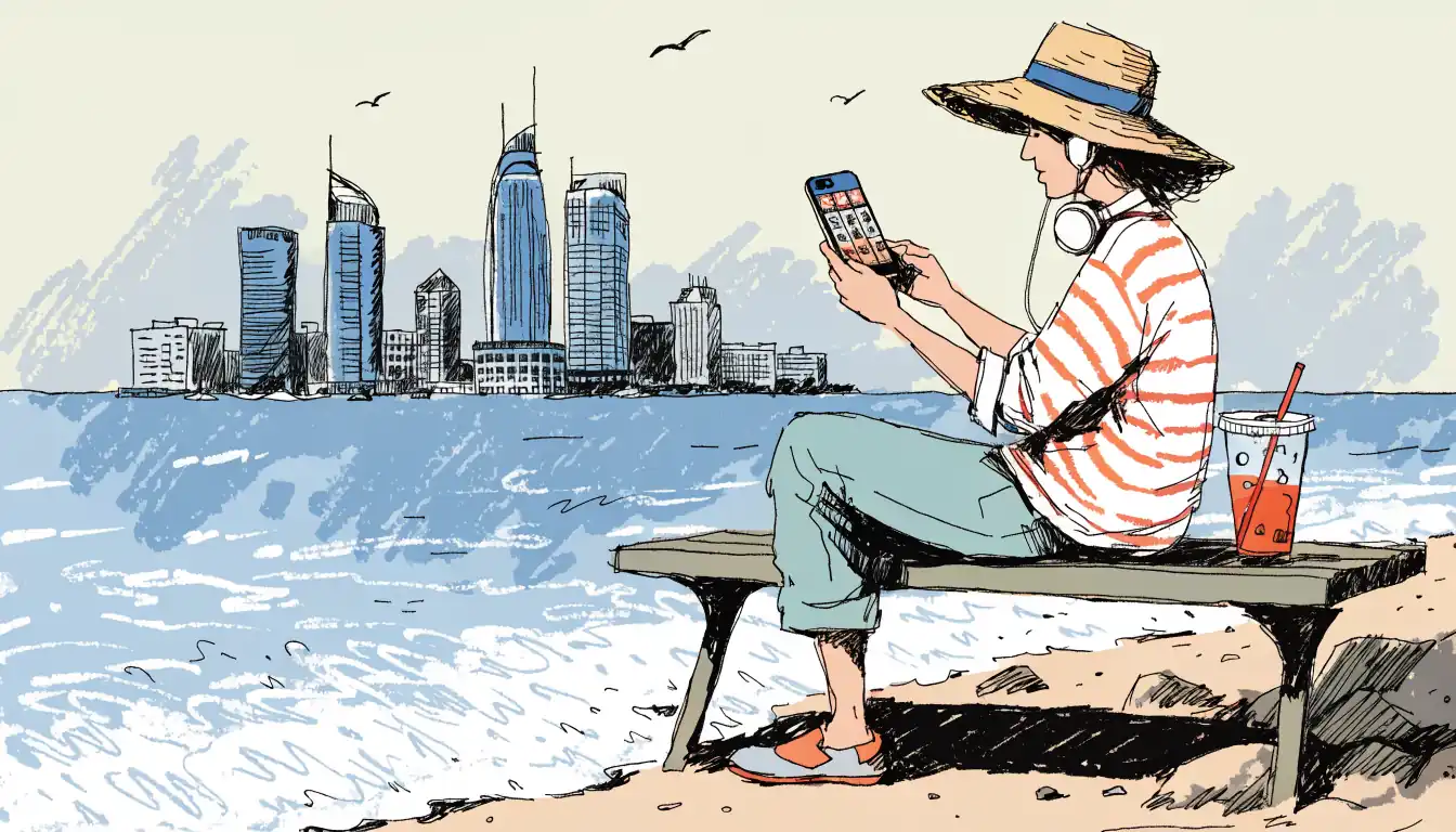Person playing online pokies on phone at Perth beach