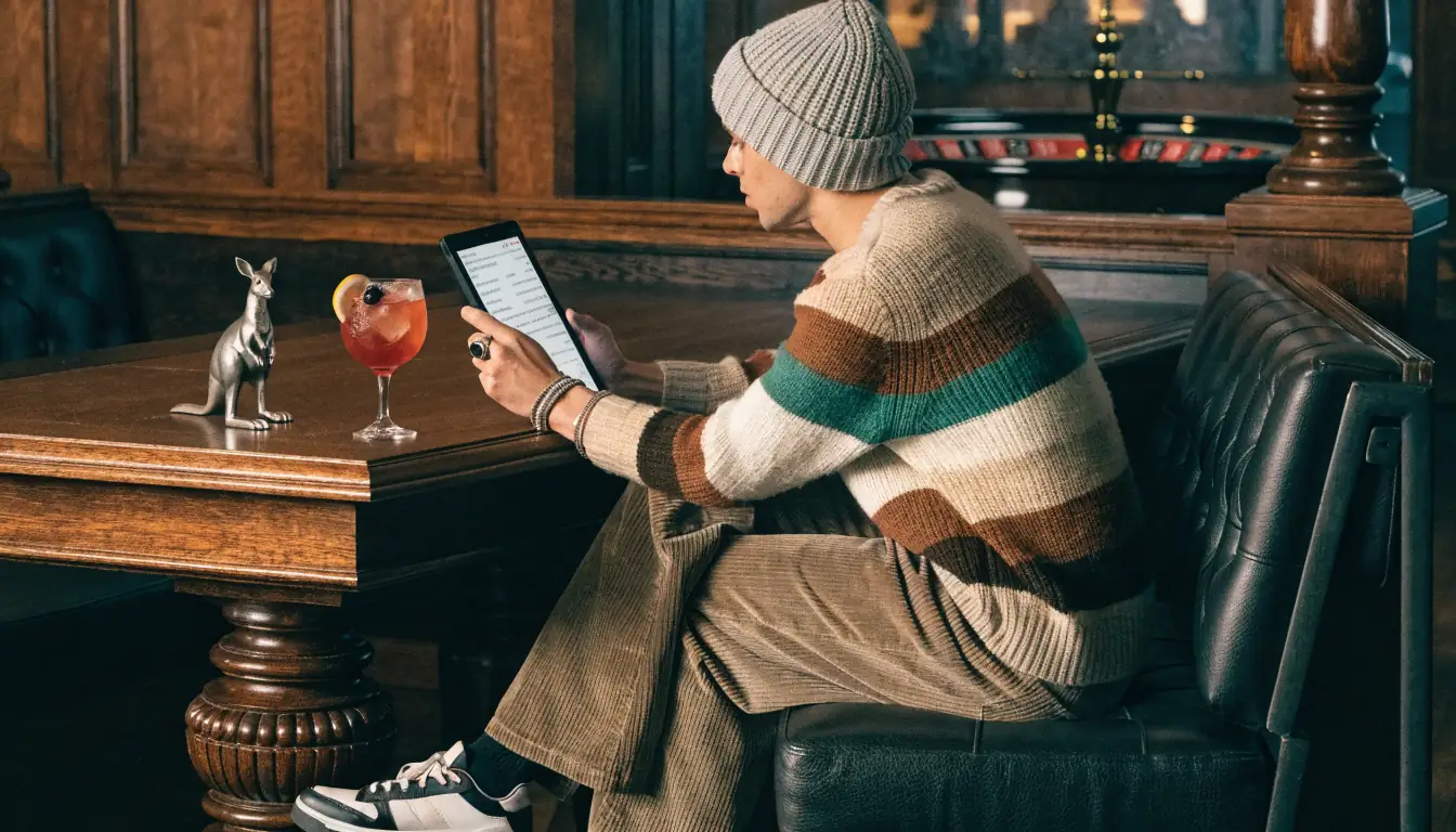 Player reviewing wagering terms on tablet in casino